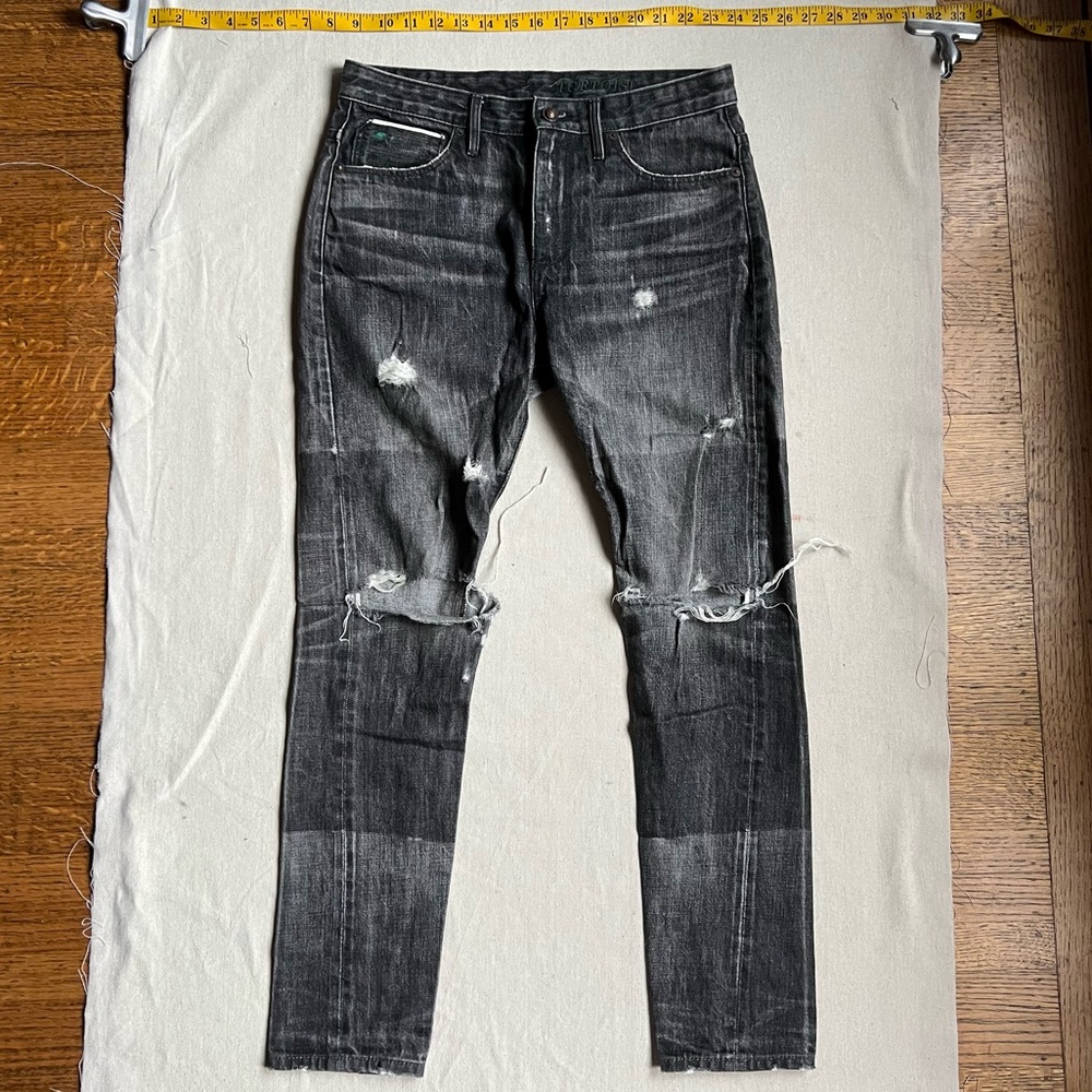 Distressed grey curved seam Tortoise jeans